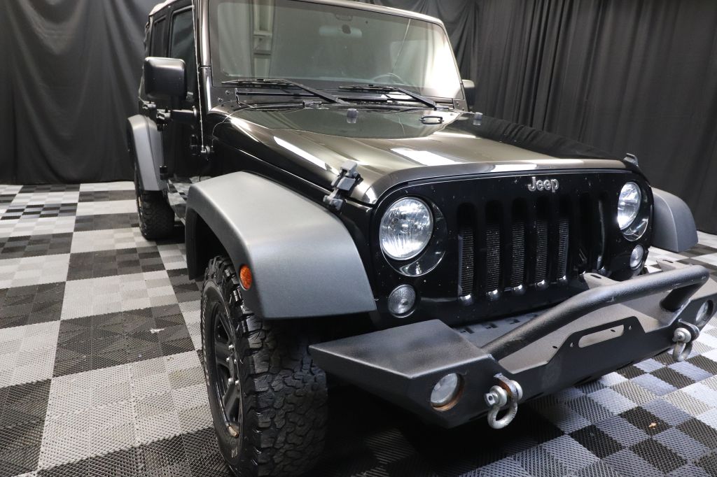 2015 JEEP WRANGLER UNLIMI SPORT for sale at Solid Rock Auto Group