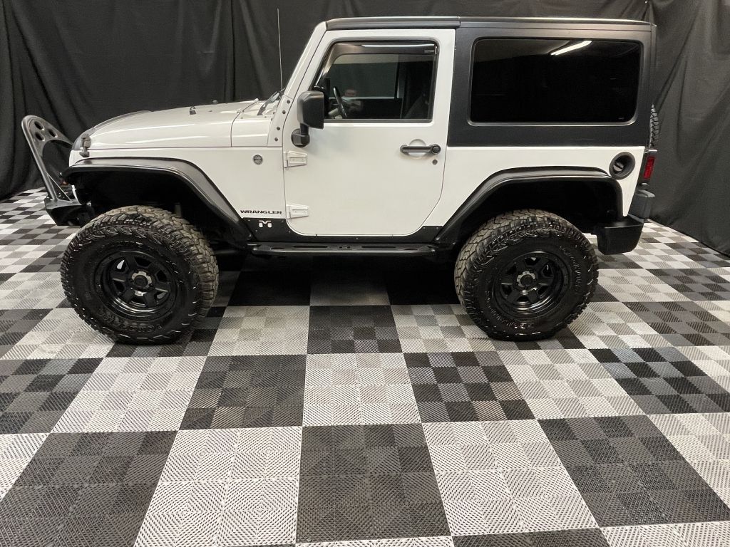 2015 JEEP WRANGLER SAHARA for sale at Solid Rock Auto Group