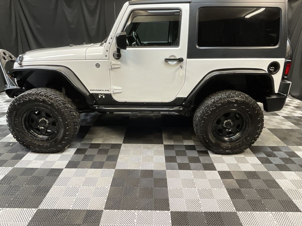 2015 JEEP WRANGLER SAHARA for sale at Solid Rock Auto Group