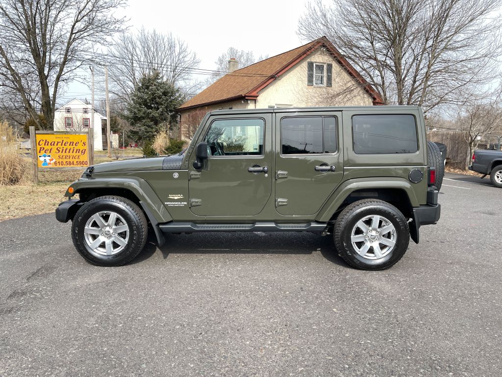 2015 JEEP WRANGLER UNLIMI SAHARA for sale at Source One Auto Group