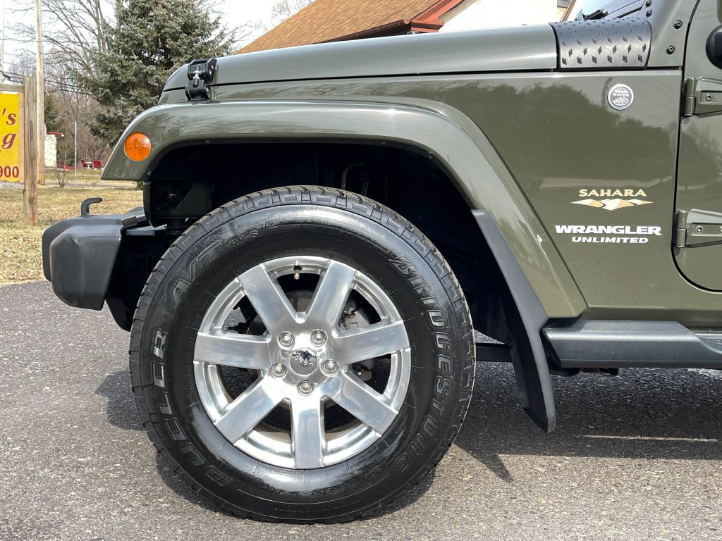 2015 JEEP WRANGLER UNLIMI SAHARA for sale at Source One Auto Group