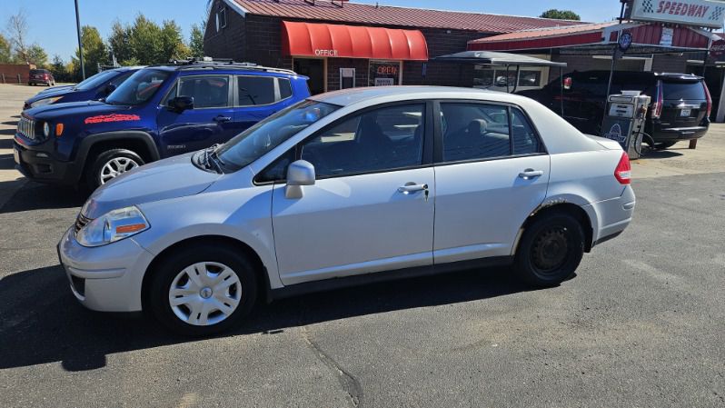 Silver 2011 Nissan Versa Sedan Front-Wheel Drive Automatic