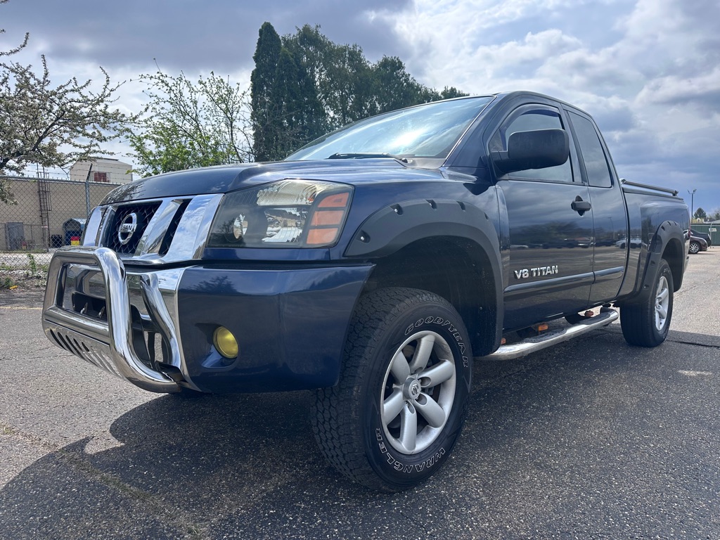 Blue 2010 Nissan Titan Pickup Truck Four-Wheel Drive Automatic